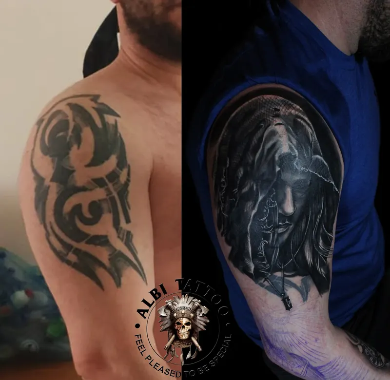 Before and after on one shoulder: an old tribal piece and the black and grey portrait that replaced it