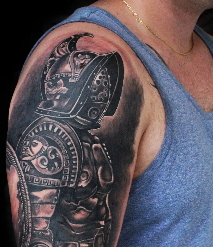 Black and grey armoured warrior on an upper arm